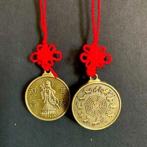 Kwan Yin and Chinese Zodiac Animal Coin on a Red Knot Lucky Charm.